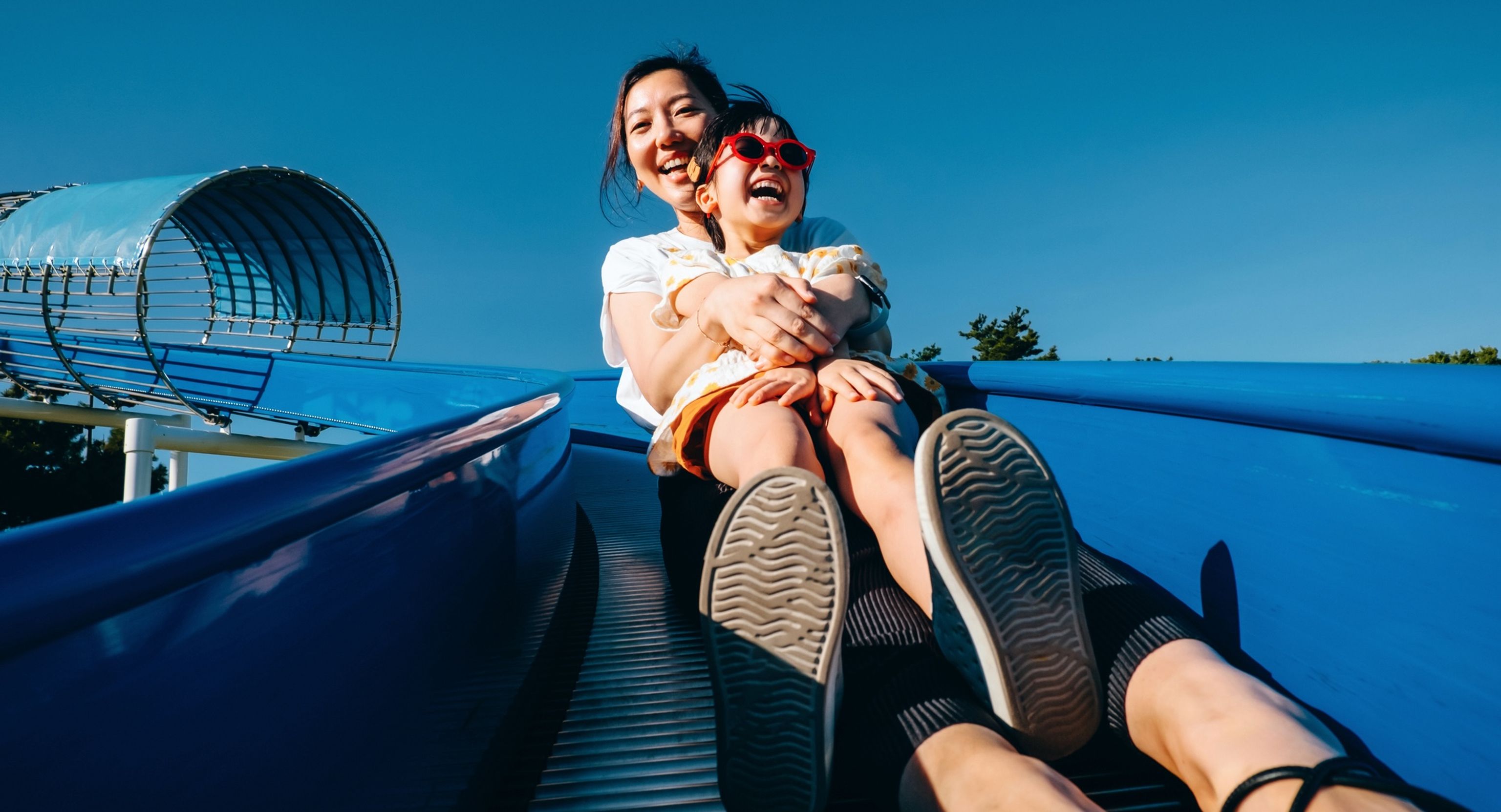 Mother and daughter enjoying a theme park in San Diego