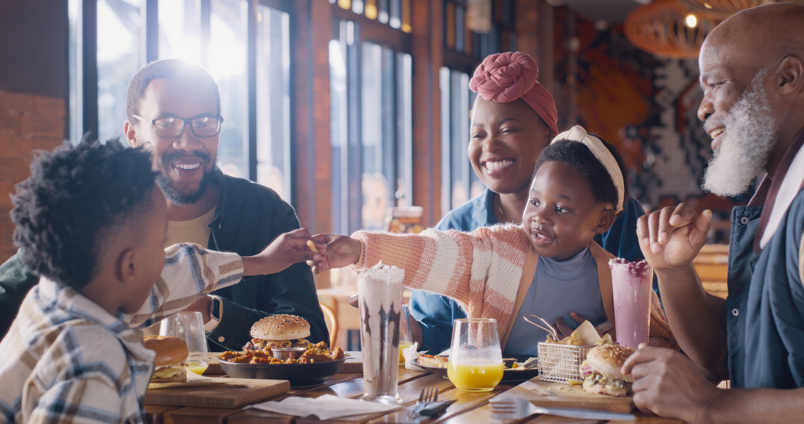 Family enjoying a meal at a family-friendly restaurant in San Diego